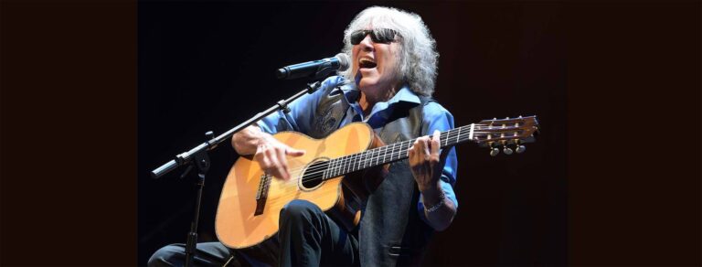 jose feliciano playing his guitar