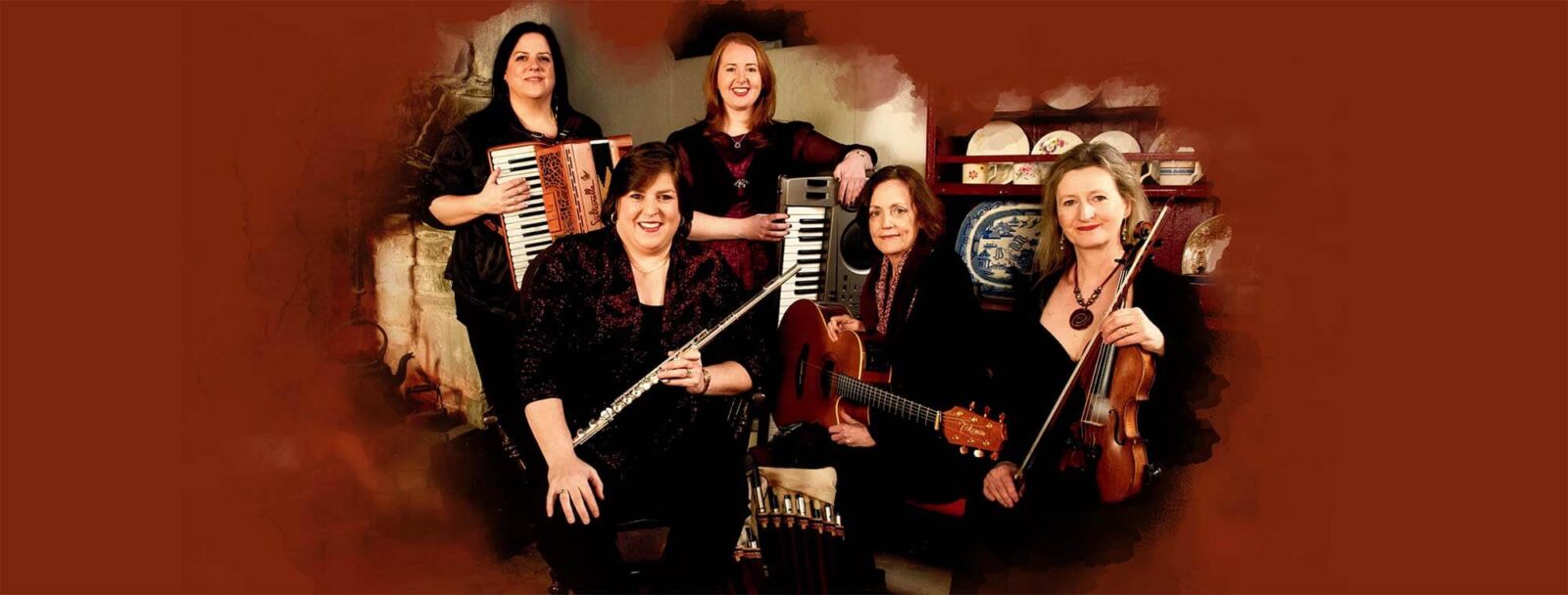 Five females with their musical instruments at hand, dressed in black with their hairs loose.