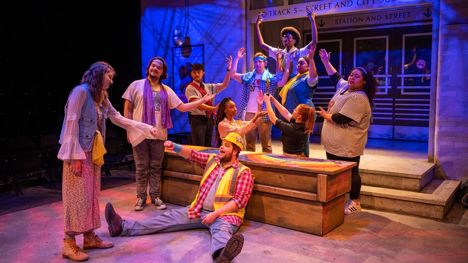 A group of Kean students on the stage of the production of Godspell